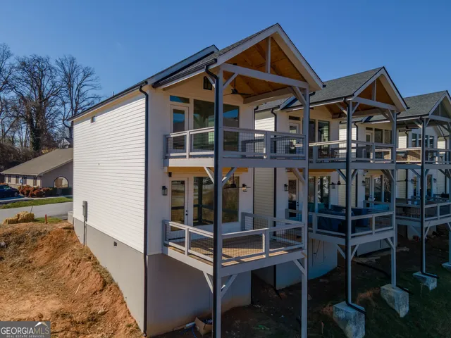 a front view of a house with parking space