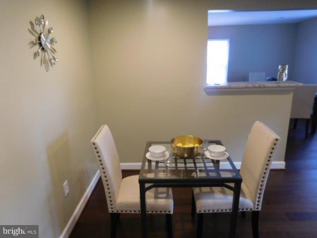 3411 Oaklawn Road Fort Washington, MD 20744 - Photo 23 of 30 a view of a dining room with furniture and wooden floor
