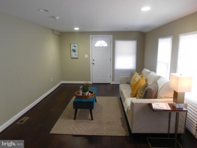3411 Oaklawn Road Fort Washington, MD 20744 - Photo 25 of 30 a living room with furniture and wooden floor