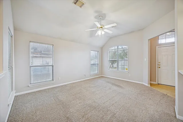 a view of an empty room with a window