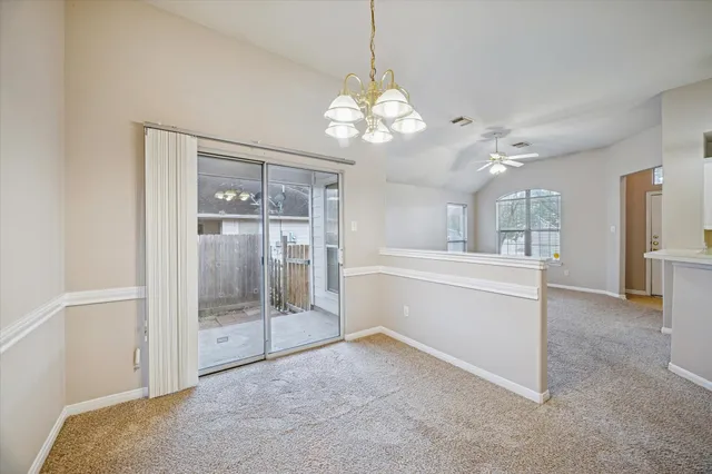 a view of a hallway with a chandelier