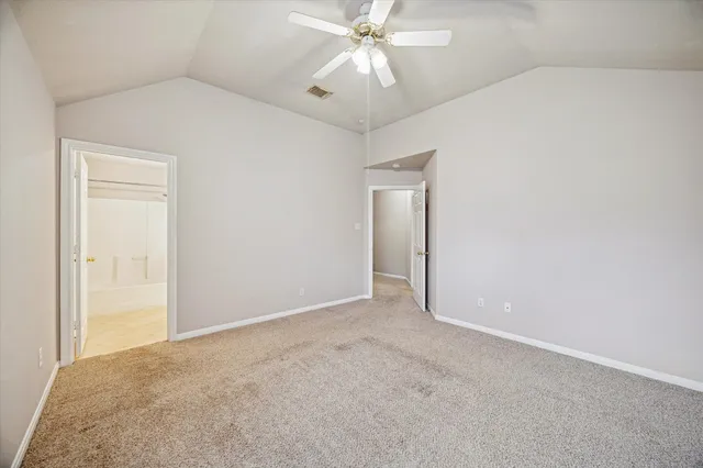 an empty room with fan and fan