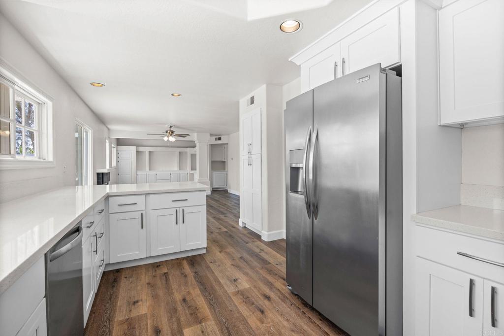 4595 Blackwell Road Oceanside, CA 92056 - Photo 15 of 47 a large kitchen with a refrigerator and a sink