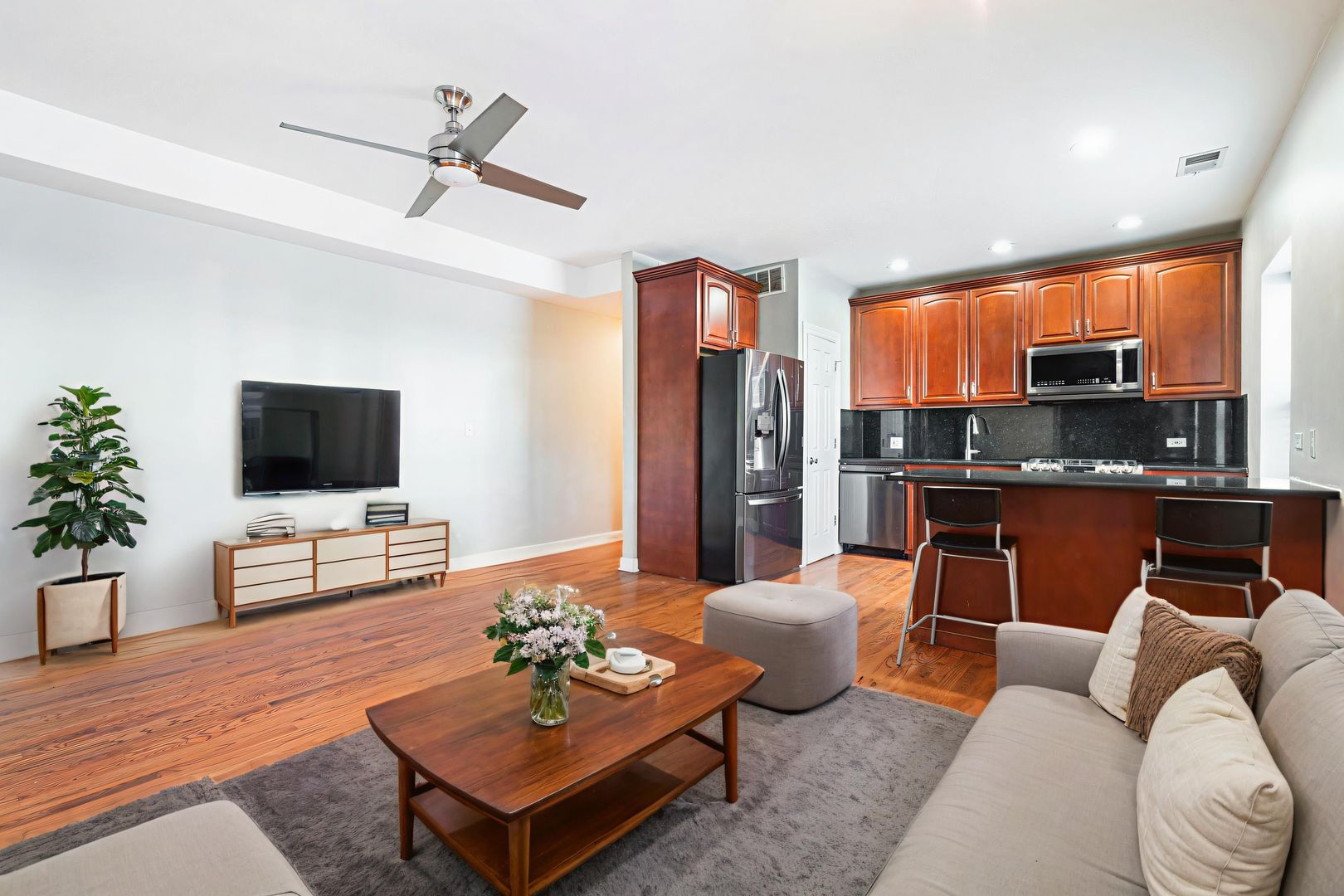 6324 South Kimbark Avenue, Unit 104 Chicago, IL 60637 - Photo 4 of 18 a living room with furniture kitchen view and a window