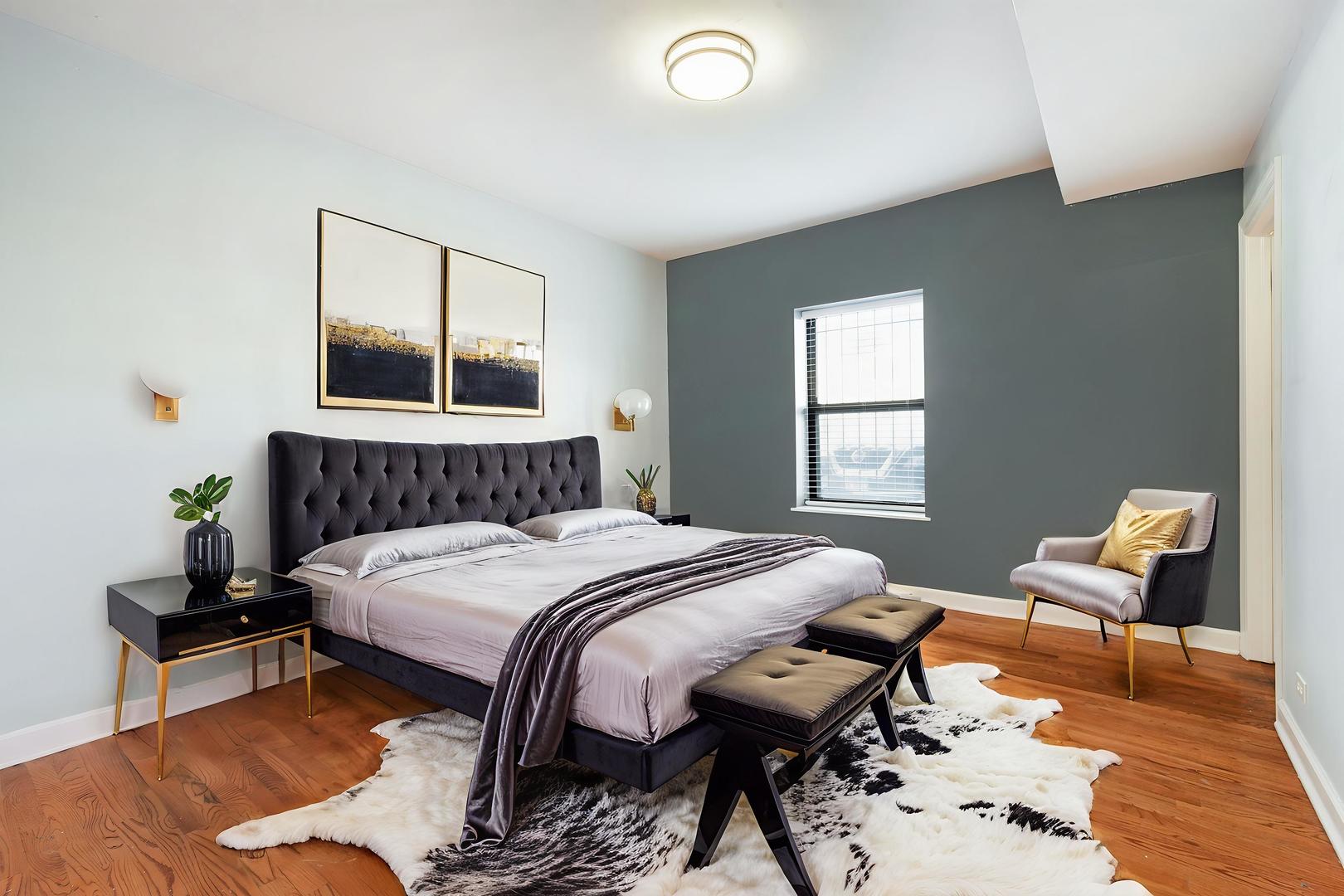 6324 South Kimbark Avenue, Unit 104 Chicago, IL 60637 - Photo 9 of 18 a bedroom with a bed and wooden floor