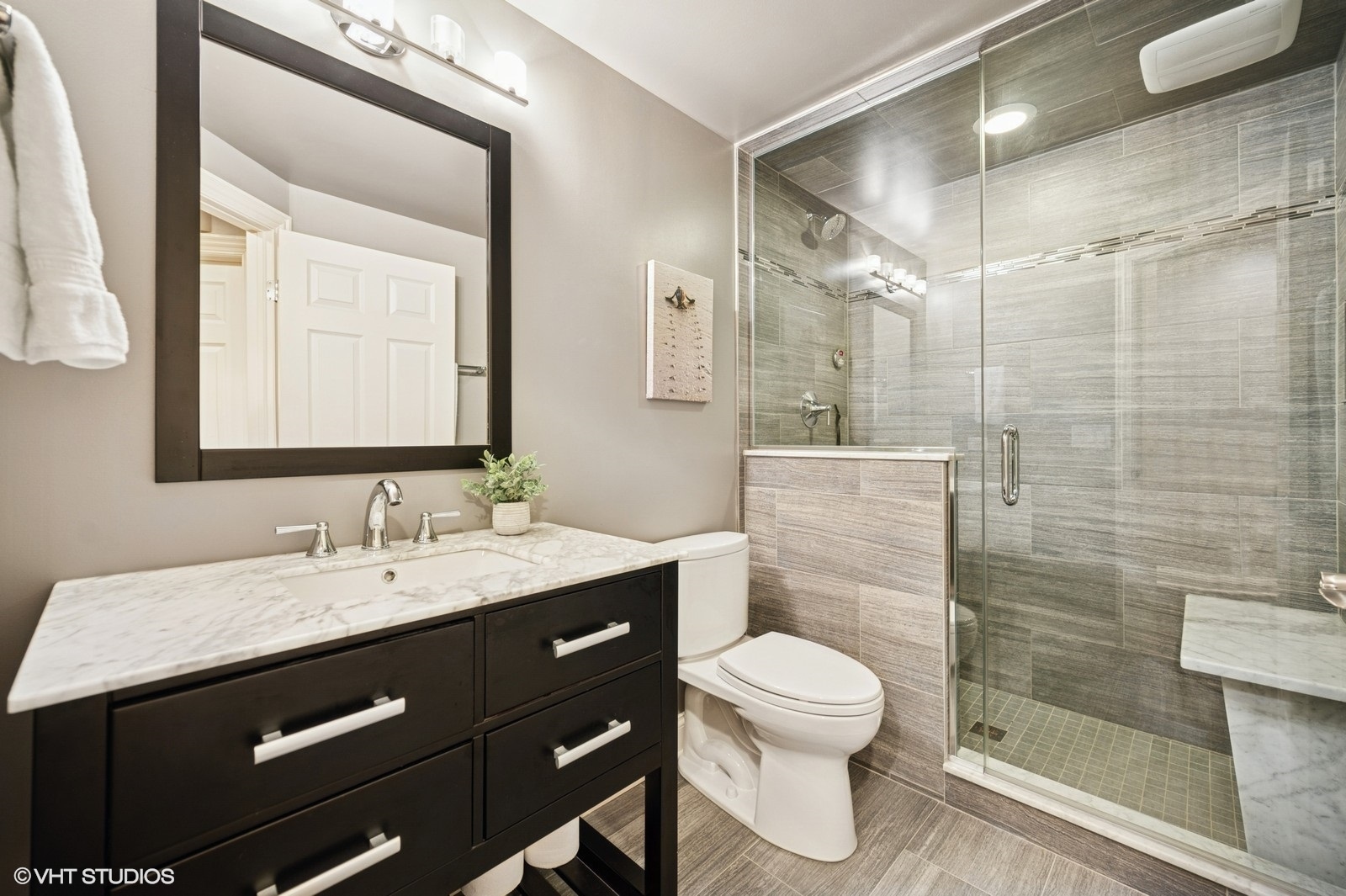 1613 Constitution Drive Glenview, IL 60026 - Photo 31 of 40 a bathroom with a sink a toilet and shower