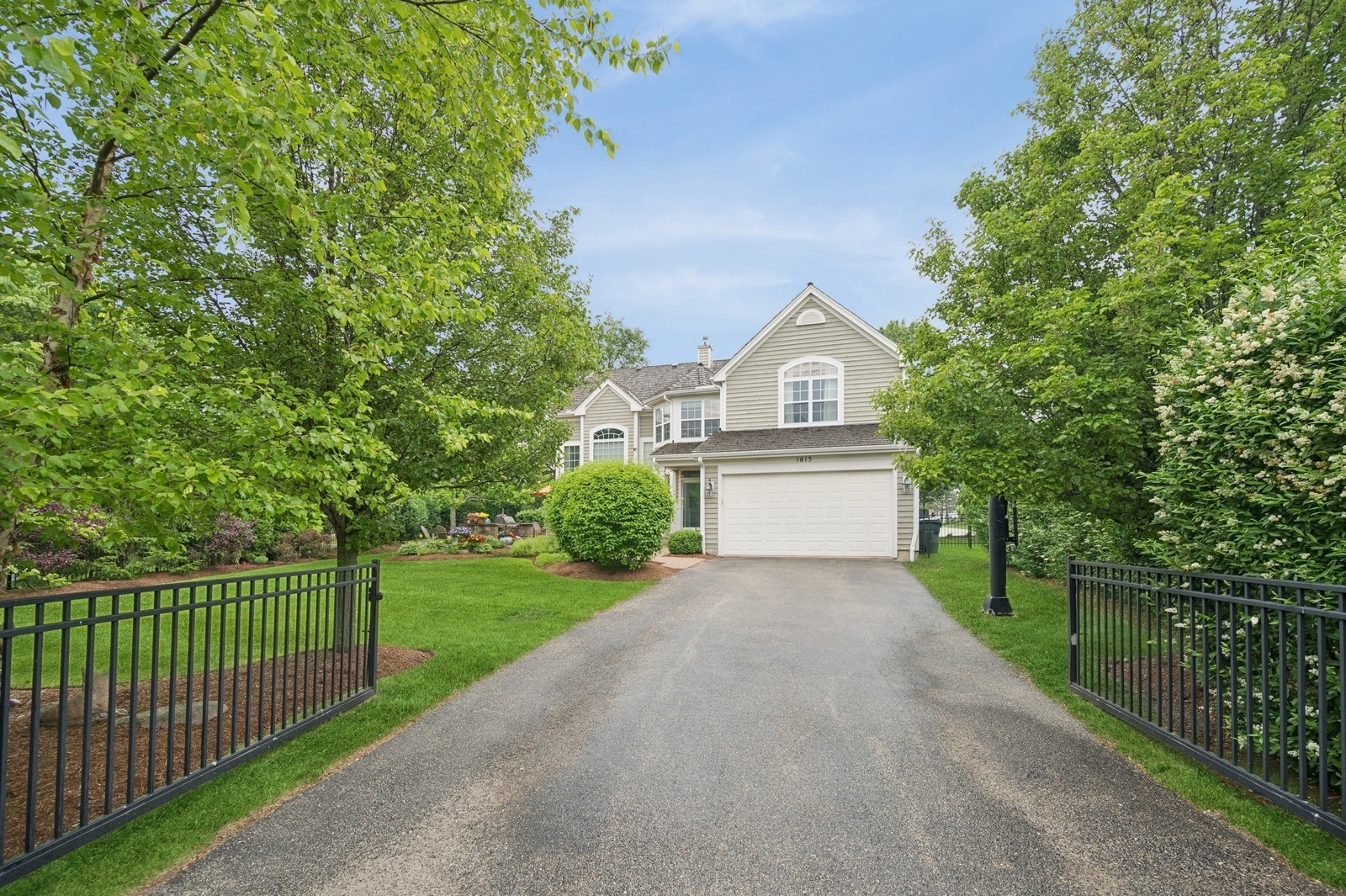 1613 Constitution Drive Glenview, IL 60026 - Photo 36 of 40 a front view of a house with a garden