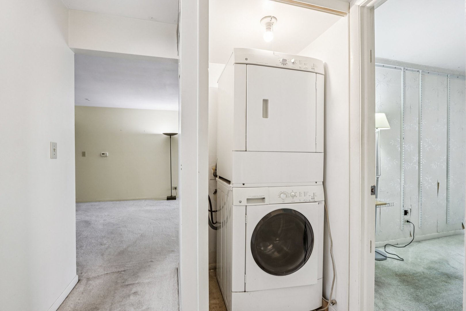 1495 South County Farm Road, Unit 24 Wheaton, IL 60189 - Photo 11 of 26 a view of a hallway with washer and dryer
