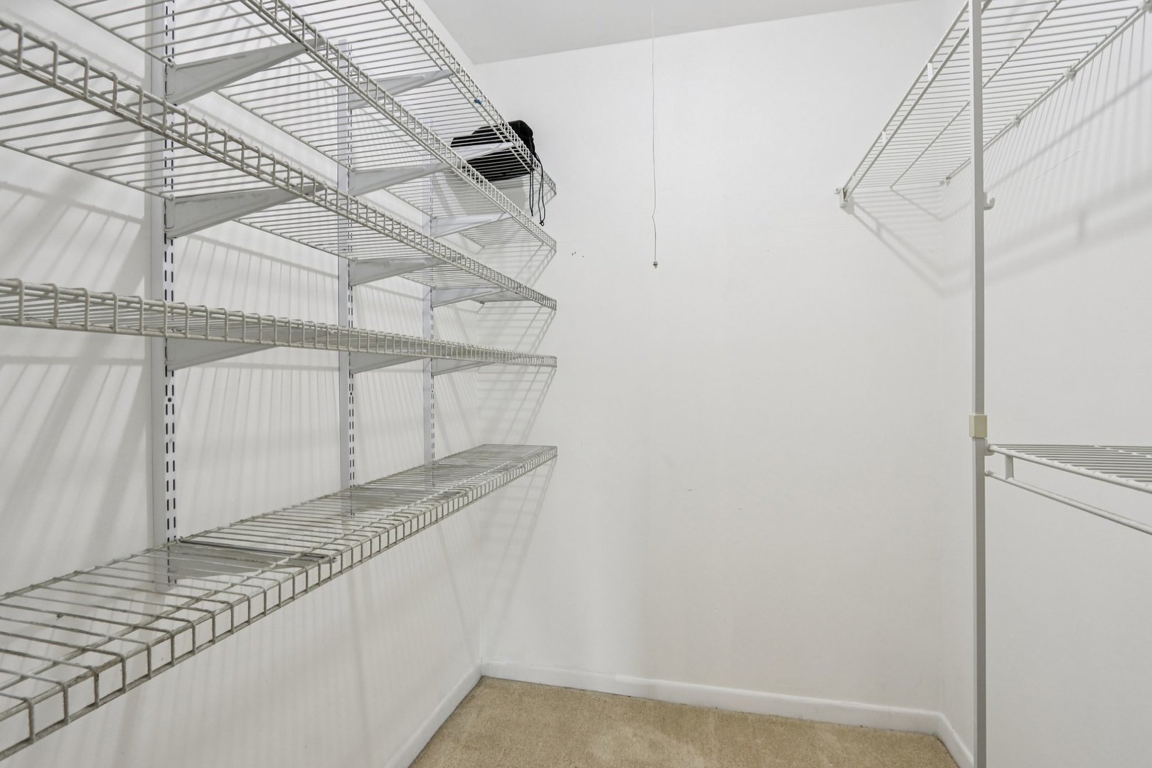 1495 South County Farm Road, Unit 24 Wheaton, IL 60189 - Photo 14 of 26 a view of a room with rack on the wall