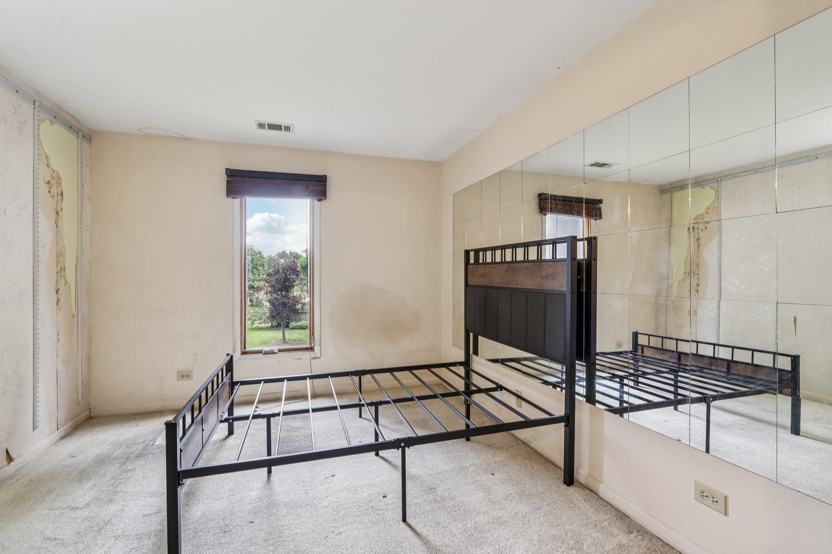 1495 South County Farm Road, Unit 24 Wheaton, IL 60189 - Photo 16 of 26 a living room with a window and a ceiling fan