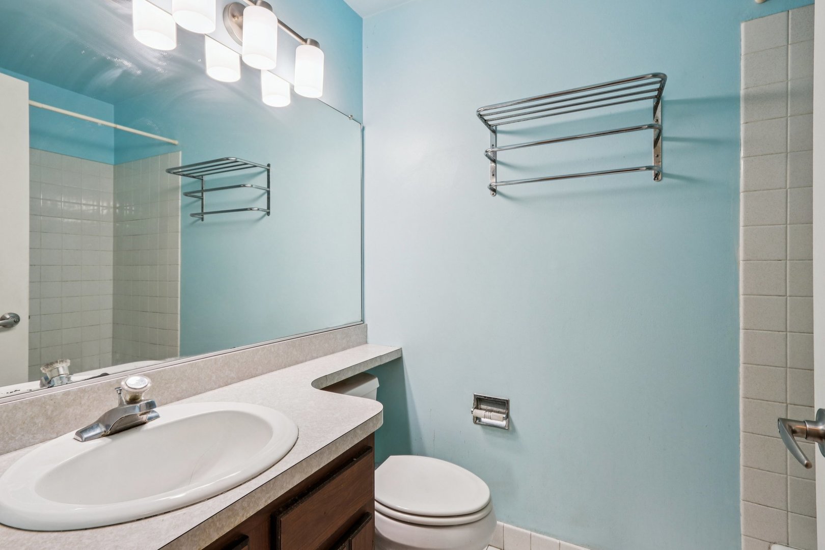 1495 South County Farm Road, Unit 24 Wheaton, IL 60189 - Photo 17 of 26 a bathroom with a sink a toilet and shower