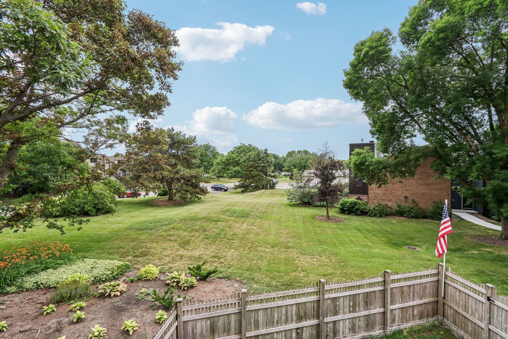 1495 South County Farm Road, Unit 24 Wheaton, IL 60189 - Photo 21 of 26 a view of a golf course with a lake
