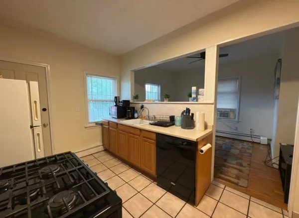 a kitchen with a stove and a sink