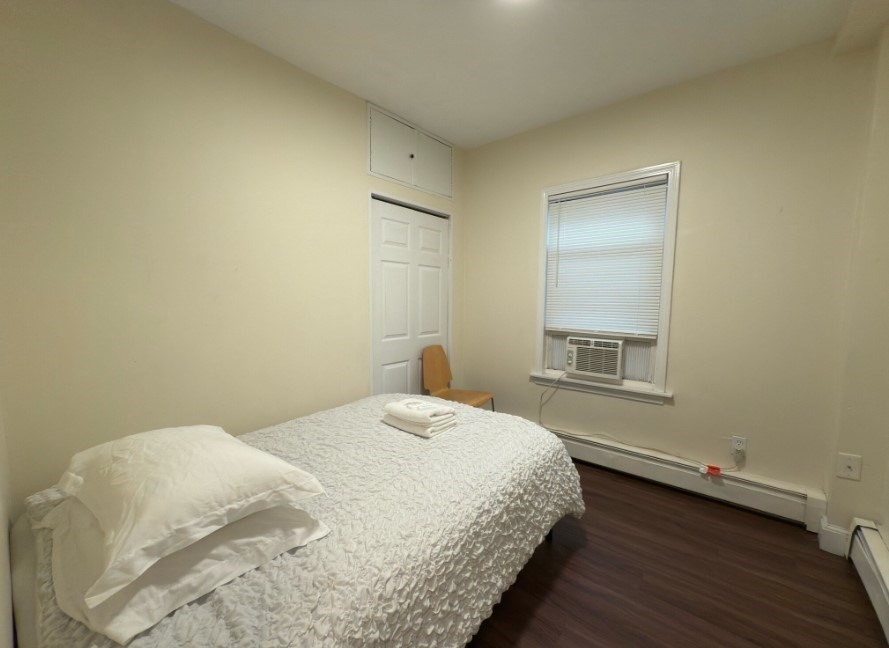 20 Pompeii Street, Unit 2 Boston, MA 02119 - Photo 7 of 8 a bedroom with a bed and a window