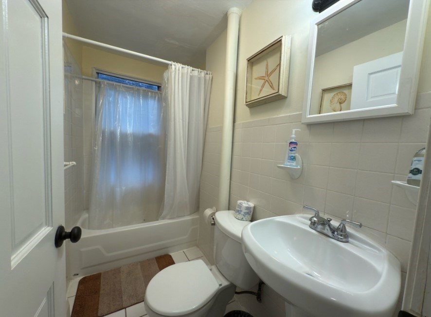 20 Pompeii Street, Unit 2 Boston, MA 02119 - Photo 8 of 8 a bathroom with a sink a toilet and shower