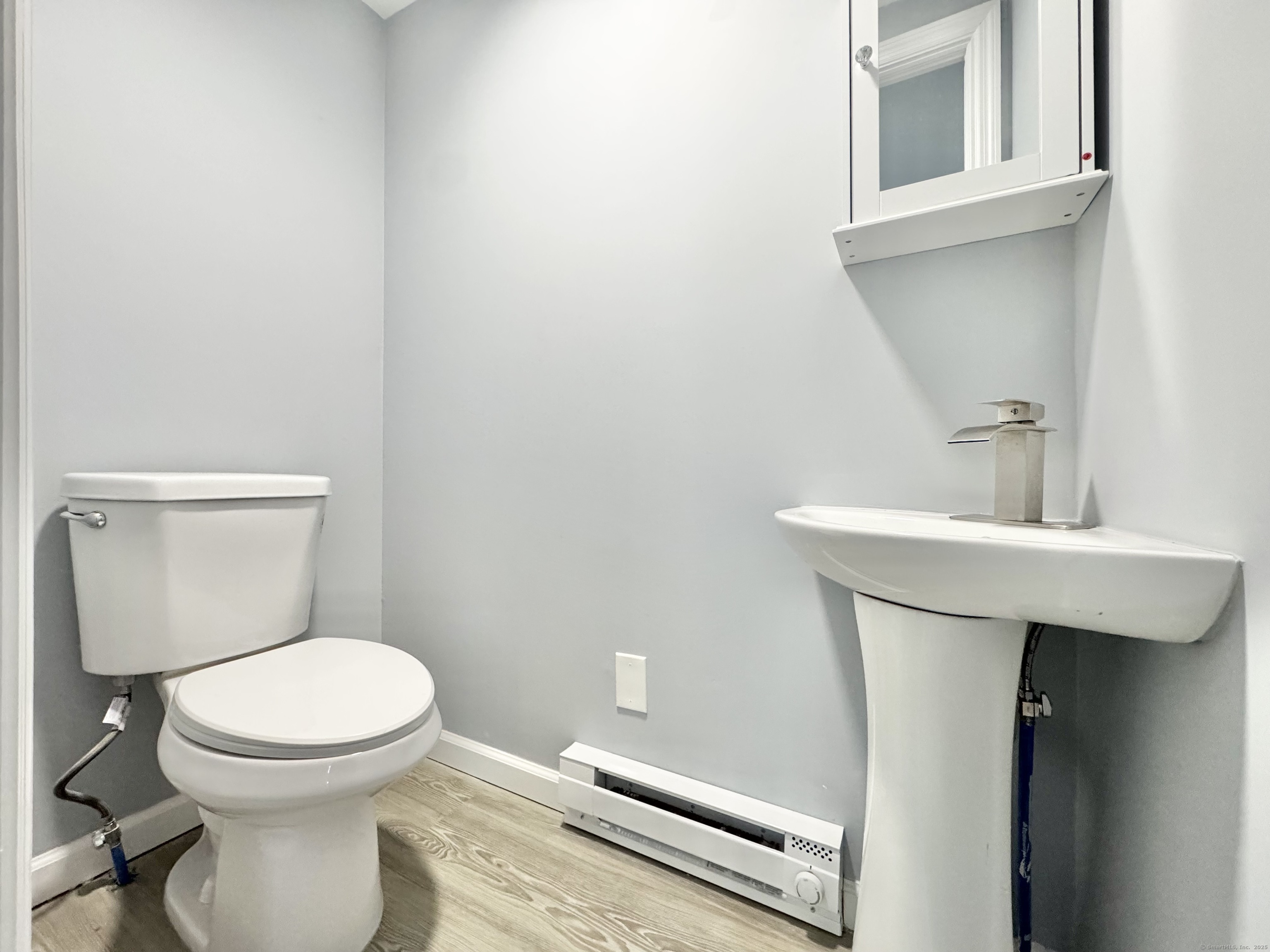 37 Goodyear Avenue Naugatuck, CT 06770 - Photo 15 of 23 a bathroom with a toilet sink and mirror