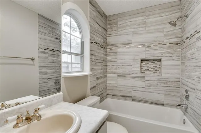 a bathroom with a sink and a bathtub