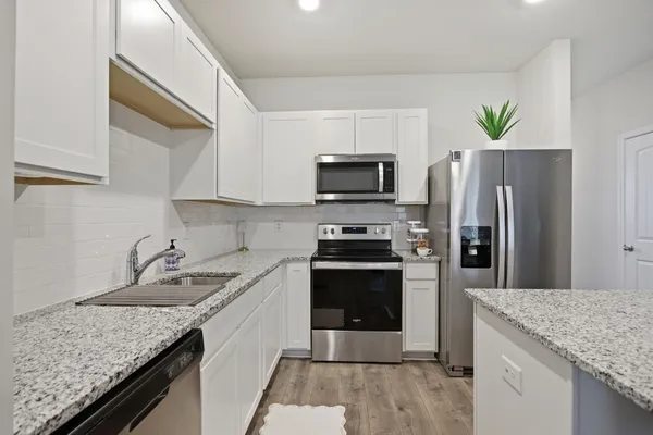 a bathroom with a sink a mirror and a toilet