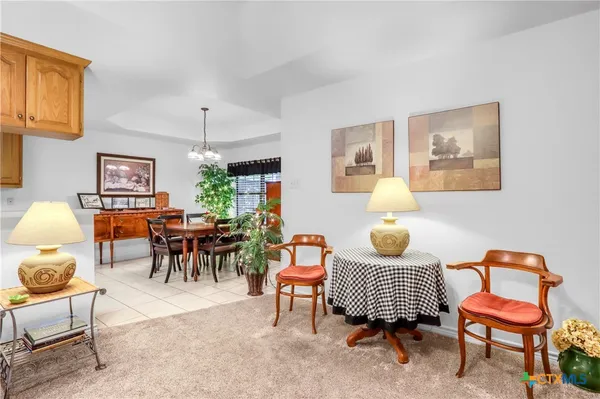 a living room with furniture a rug and a window