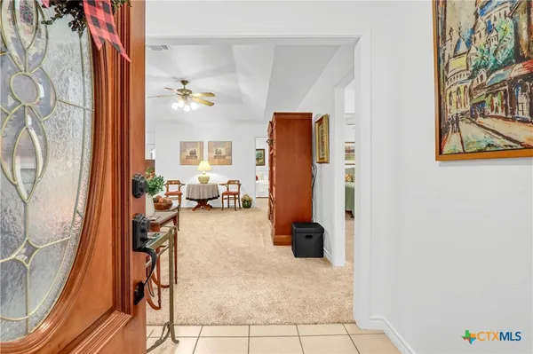 a view of a livingroom with furniture and front door