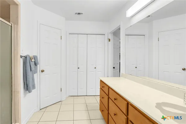 a view of bathroom with dual sinks