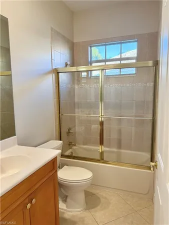 a bathroom with a toilet a sink and shower