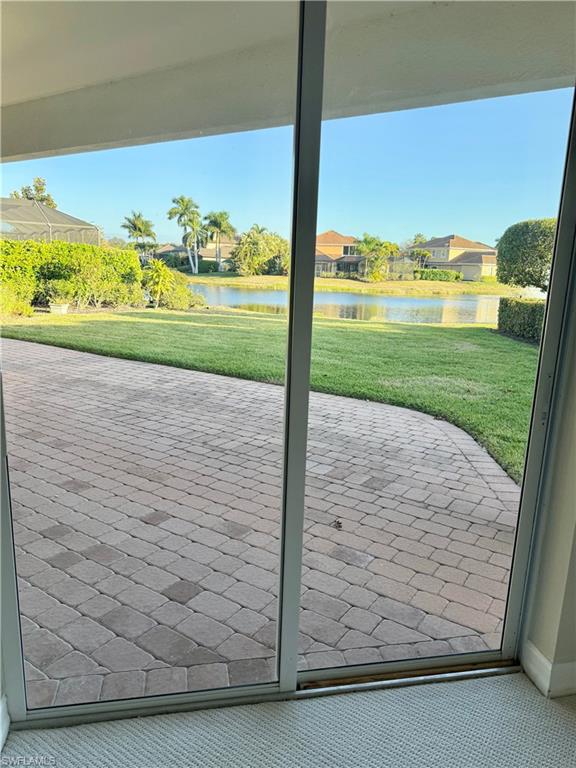 5031 Rustic Oaks Circle Naples, FL 34105 - Photo 13 of 15 Doorway to outside with a water view