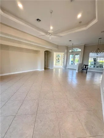 a view of an empty room with windows
