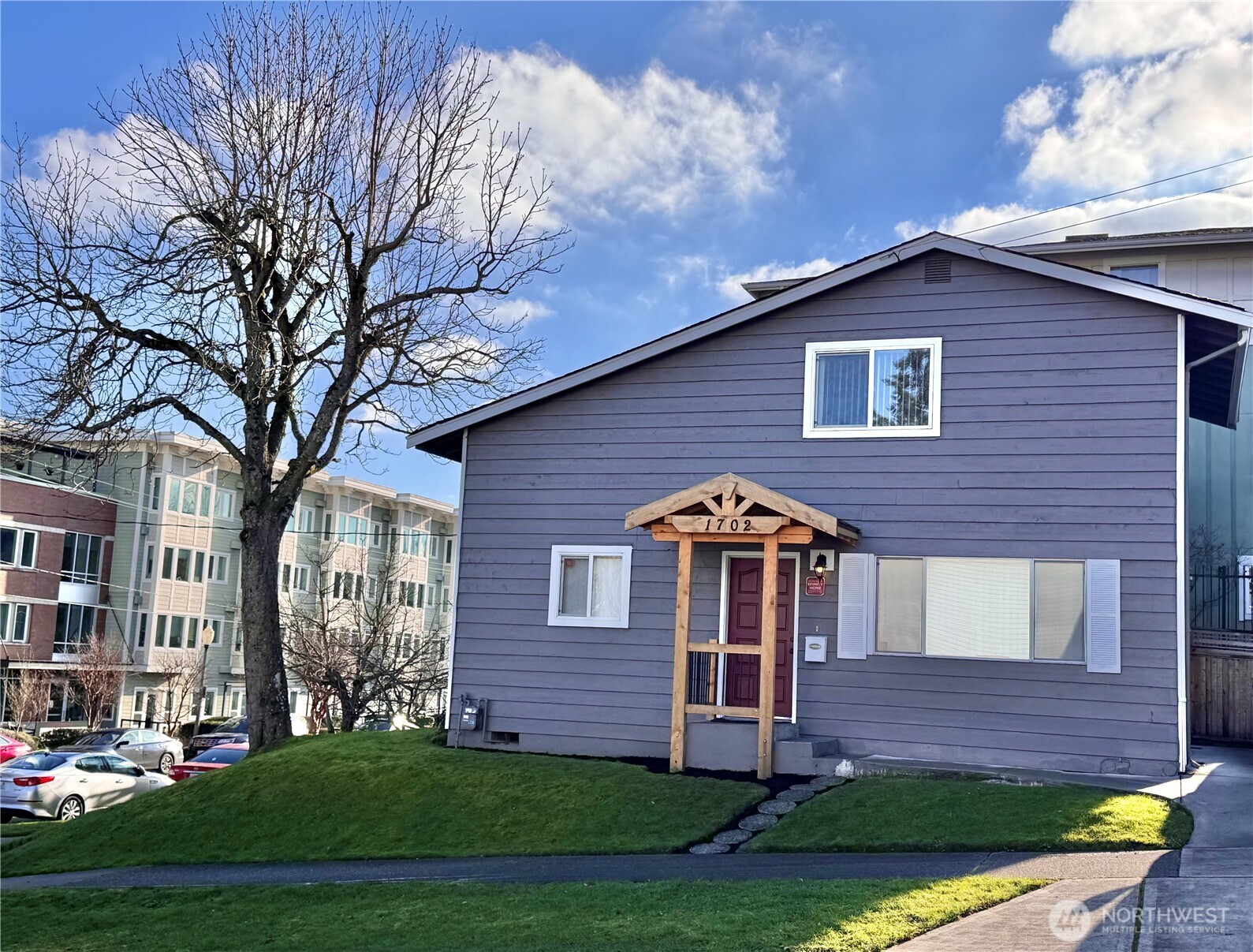 1702 South G Street Tacoma, WA 98405 - Photo 1 of 25 a front view of a house with garden