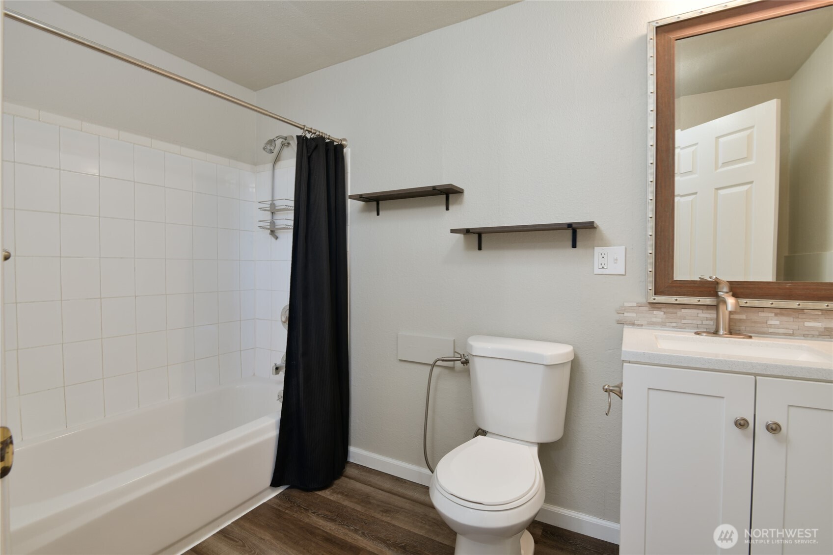 1702 South G Street Tacoma, WA 98405 - Photo 14 of 25 a bathroom with a toilet a sink and bathtub