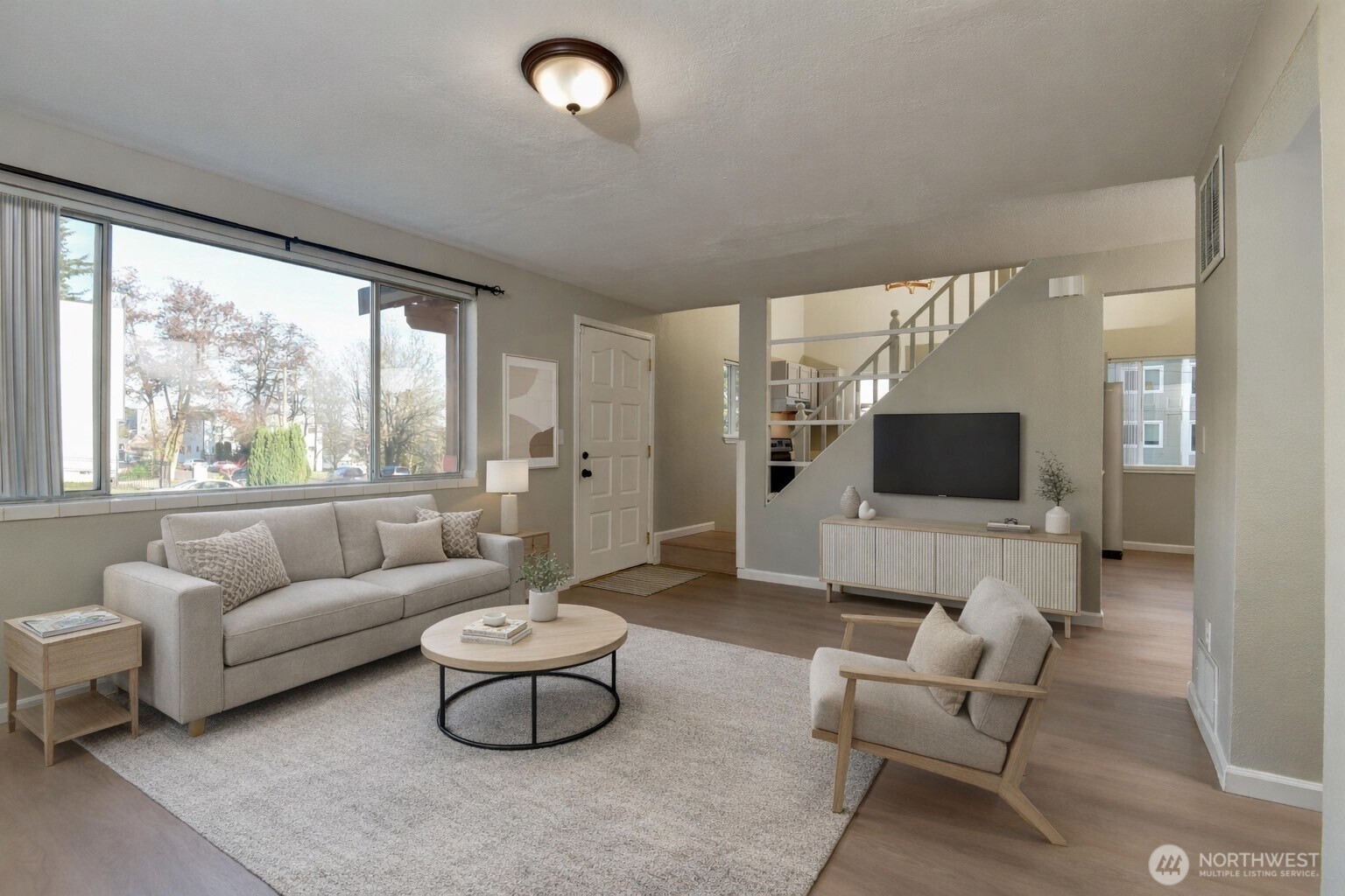 1702 South G Street Tacoma, WA 98405 - Photo 22 of 25 a living room with furniture and a flat screen tv