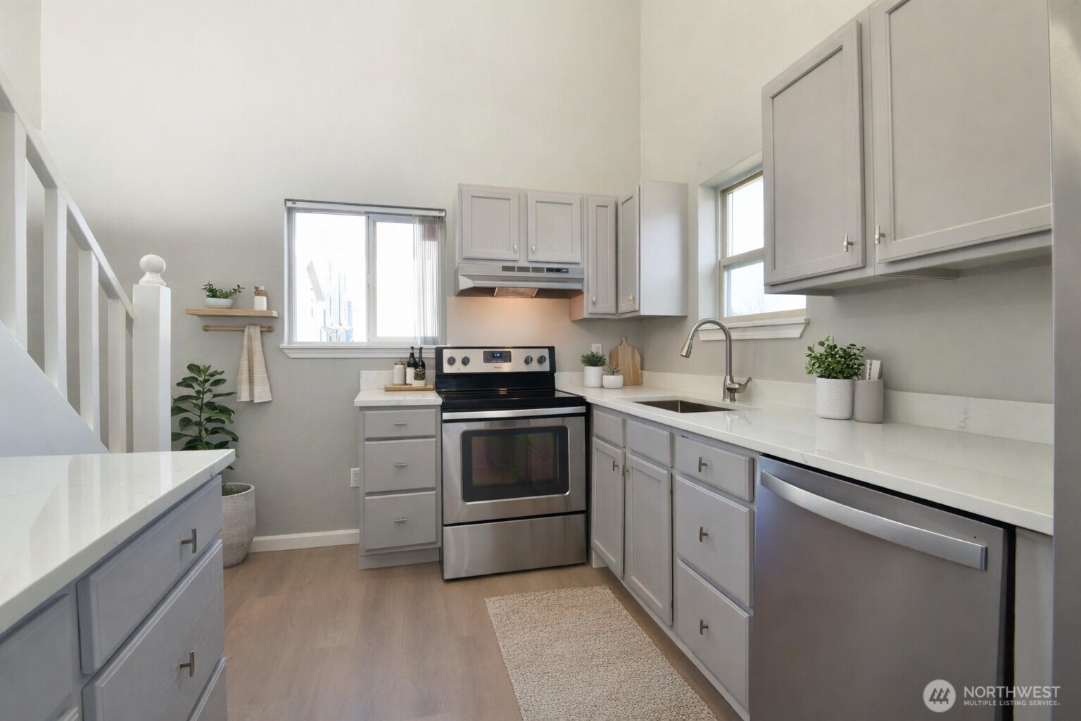 1702 South G Street Tacoma, WA 98405 - Photo 23 of 25 a kitchen with cabinets appliances a sink and a window