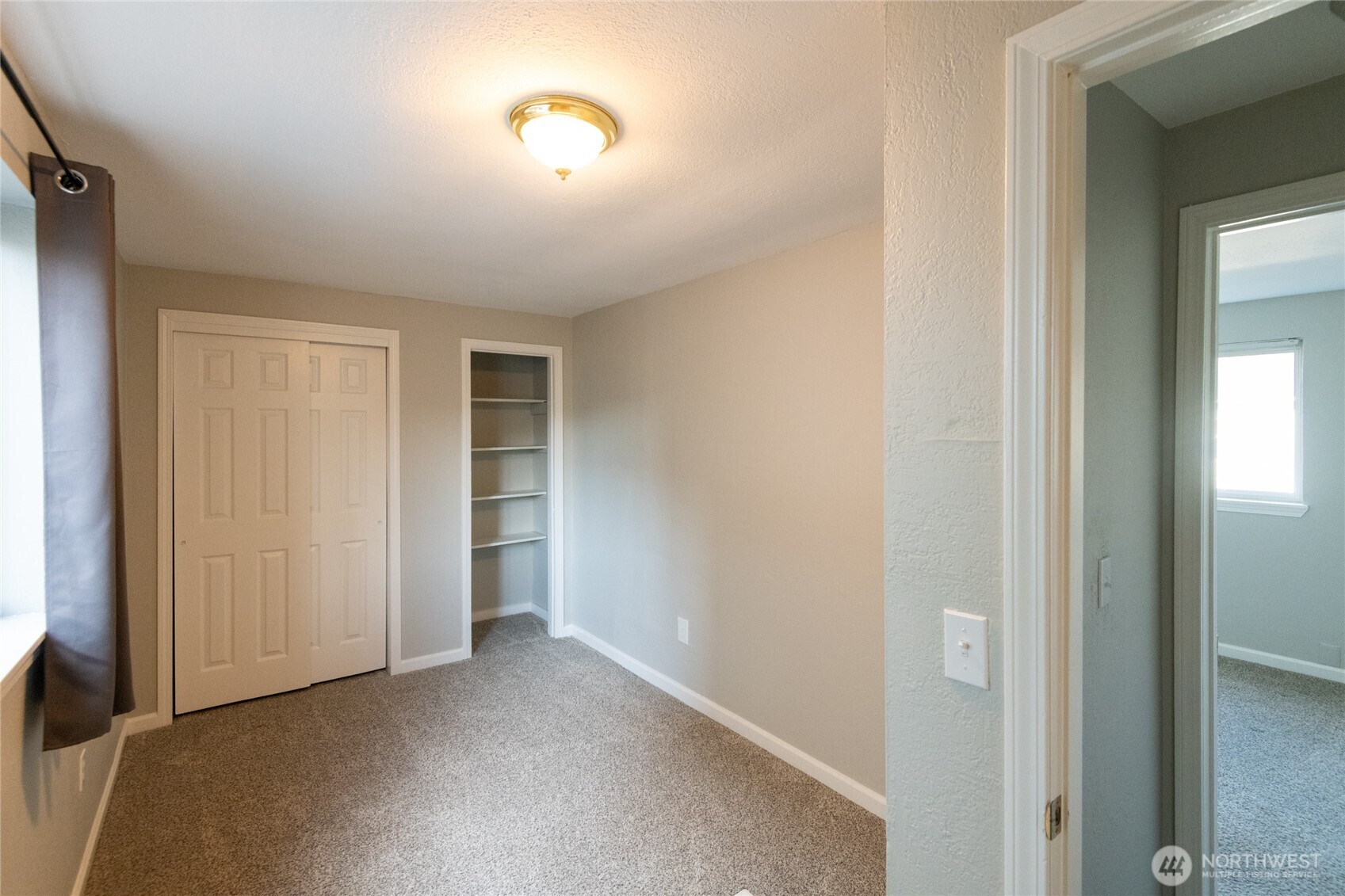 1702 South G Street Tacoma, WA 98405 - Photo 24 of 25 an empty room with closet and windows