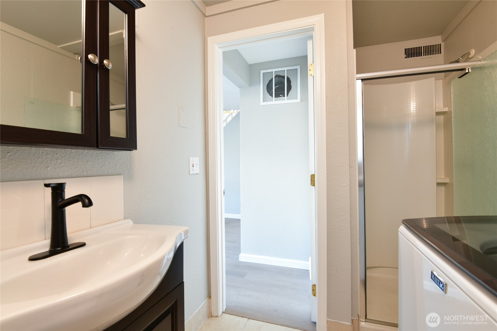 1702 South G Street Tacoma, WA 98405 - Photo 6 of 25 a bathroom with a sink and a mirror