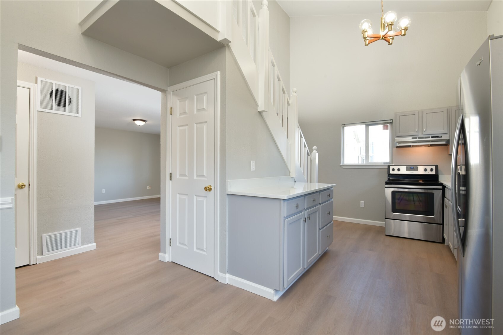 1702 South G Street Tacoma, WA 98405 - Photo 8 of 25 a kitchen with stainless steel appliances a refrigerator and a stove