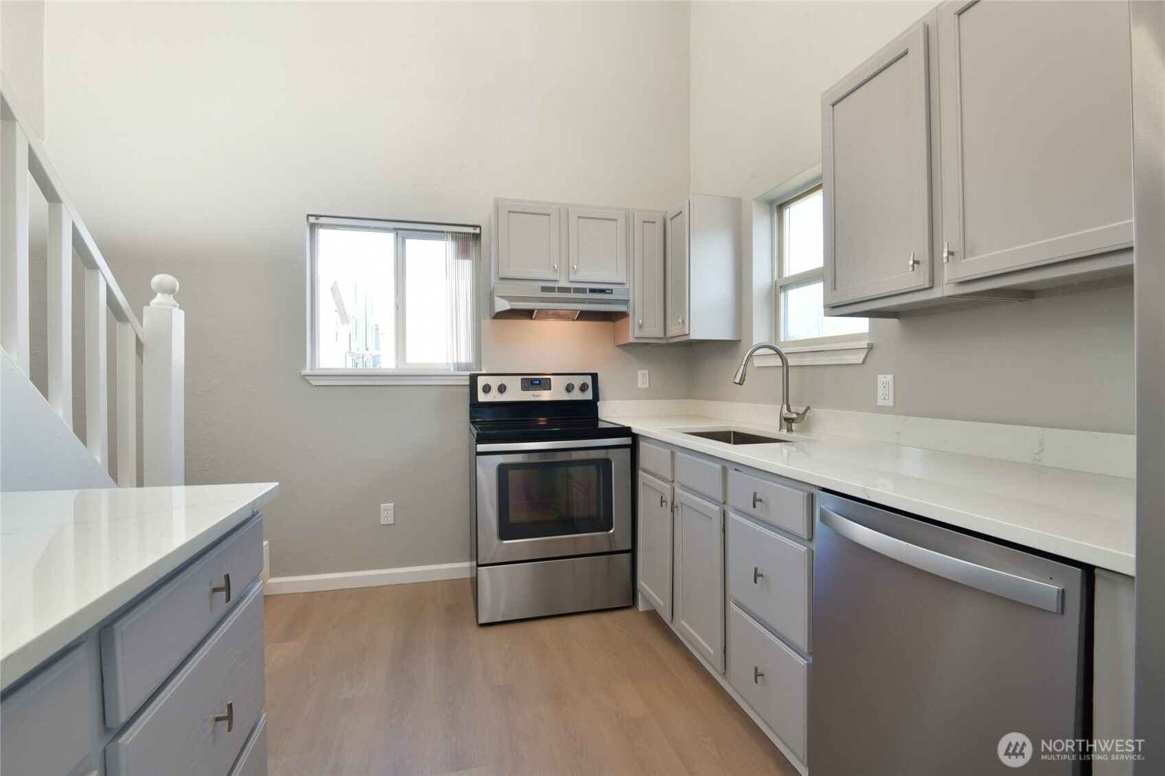 1702 South G Street Tacoma, WA 98405 - Photo 9 of 25 a kitchen with cabinets appliances a sink and a window