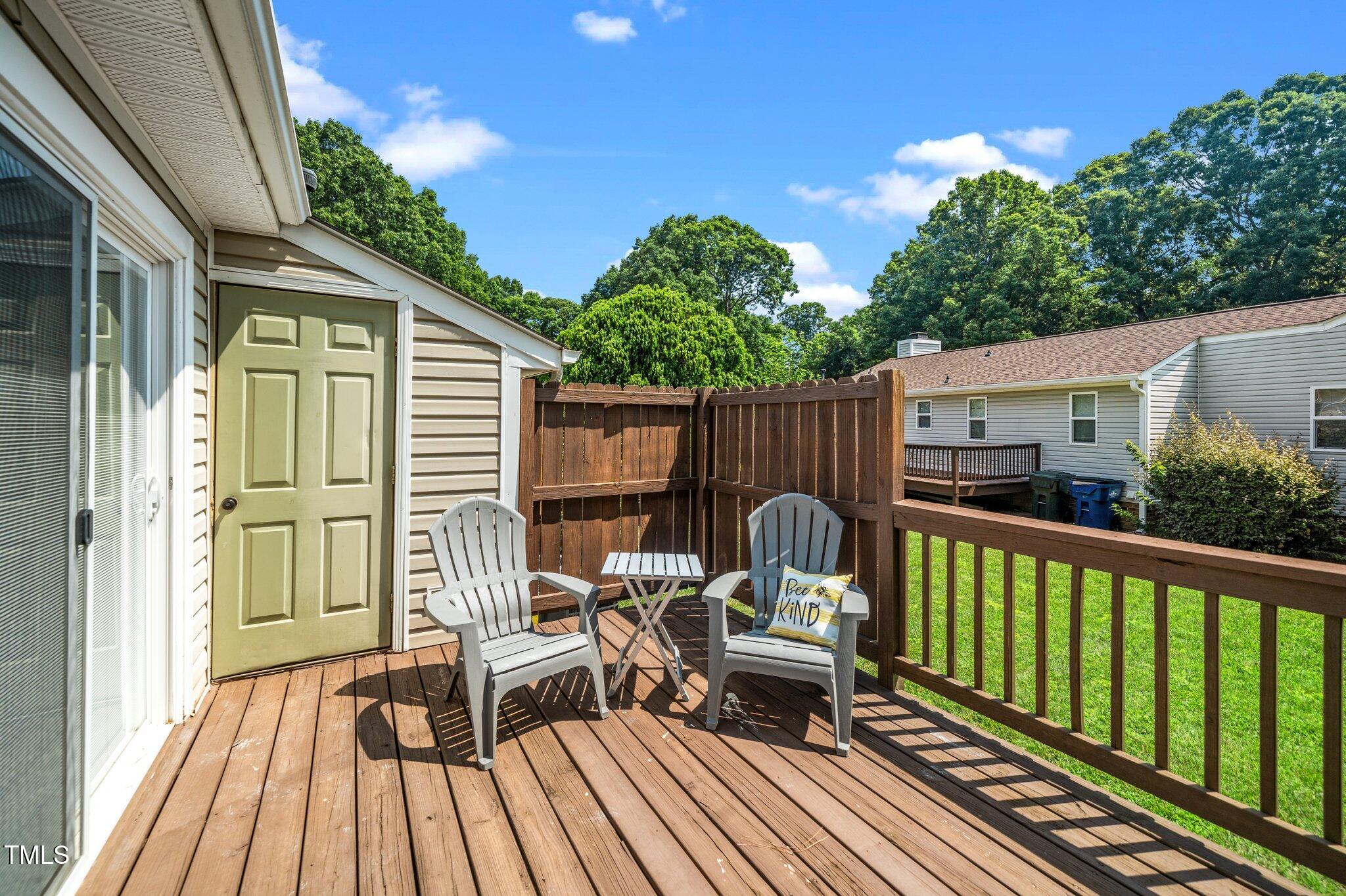 a view of balcony with furniture and wooden deck
