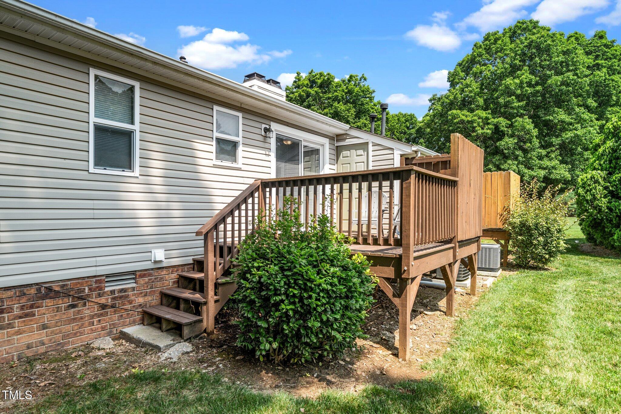 6016 Farm Gate Road Raleigh, NC 27606 - Photo 16 of 23 a view of a backyard with sitting area