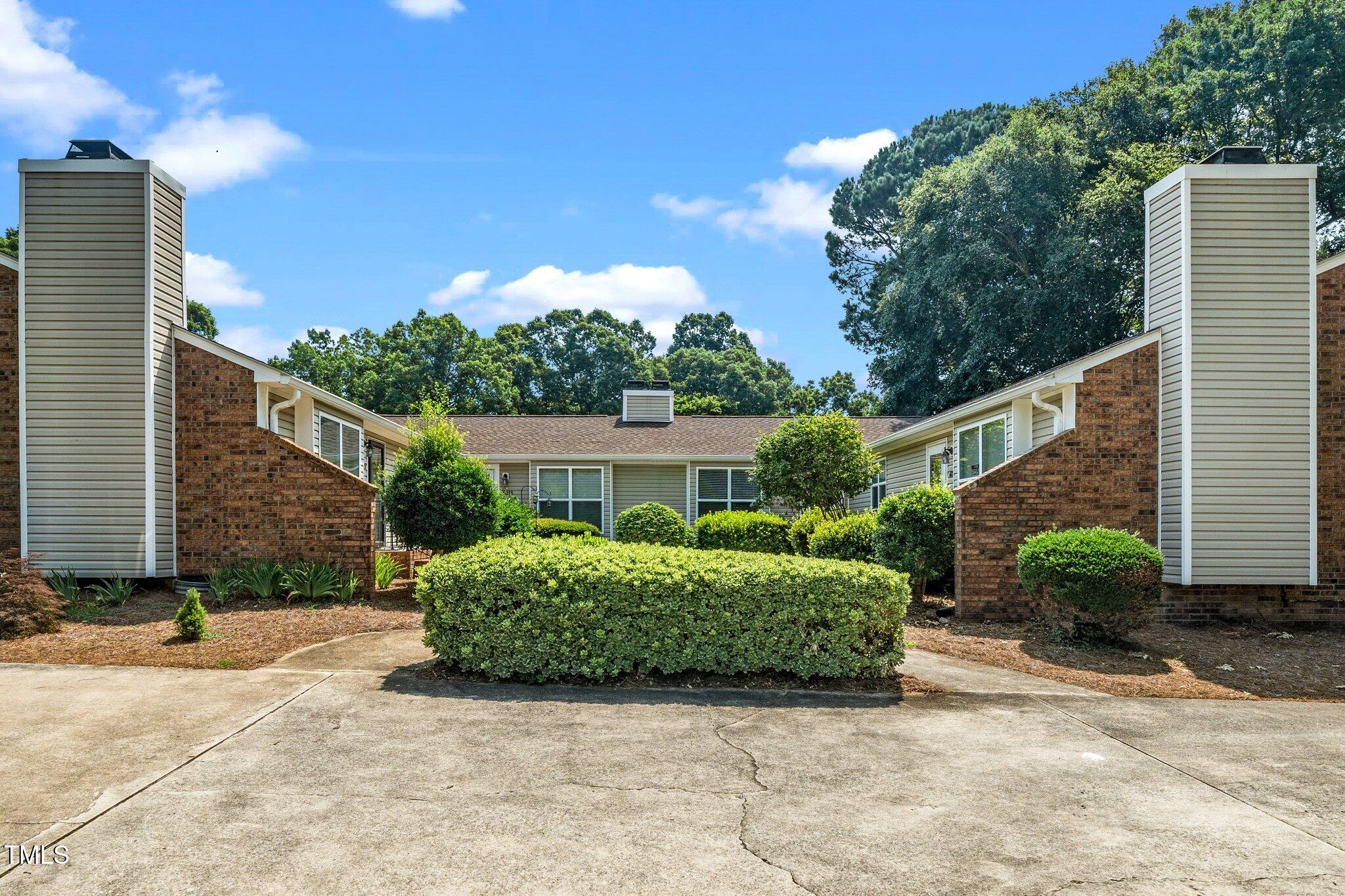 6016 Farm Gate Road Raleigh, NC 27606 - Photo 19 of 23 a view of a house with a backyard