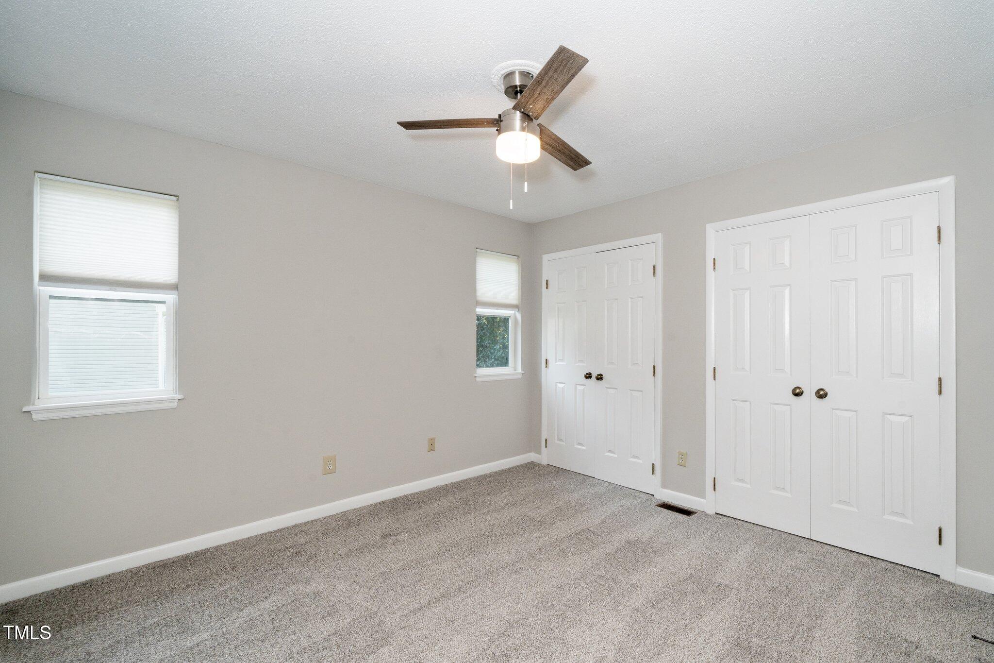6016 Farm Gate Road Raleigh, NC 27606 - Photo 6 of 23 a view of an empty room with a window