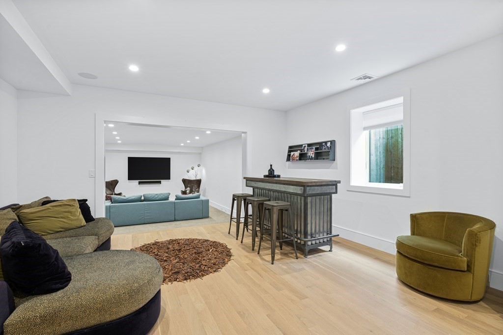 26 Salisbury Road, Unit 26 Newton, MA 02458 - Photo 15 of 27 a living room with furniture and a flat screen tv