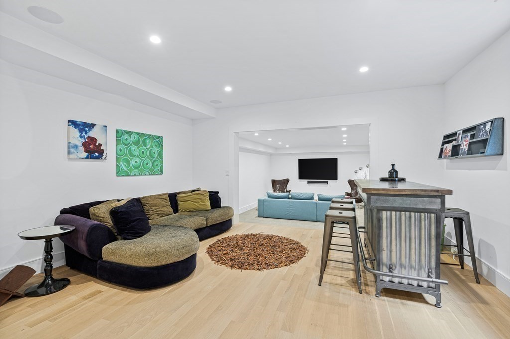 26 Salisbury Road, Unit 26 Newton, MA 02458 - Photo 16 of 27 a living room with furniture and a flat screen tv