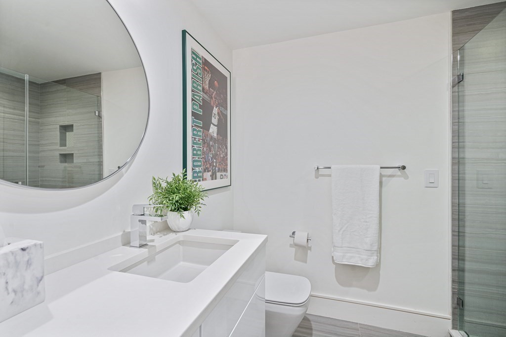 26 Salisbury Road, Unit 26 Newton, MA 02458 - Photo 19 of 27 a bathroom with a sink toilet and shower