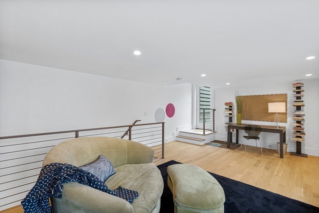 26 Salisbury Road, Unit 26 Newton, MA 02458 - Photo 21 of 27 a living room with furniture and a flat screen tv