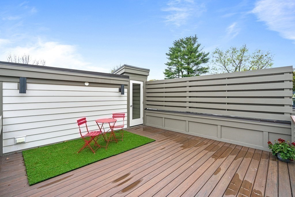26 Salisbury Road, Unit 26 Newton, MA 02458 - Photo 24 of 27 a front view of a house with a yard