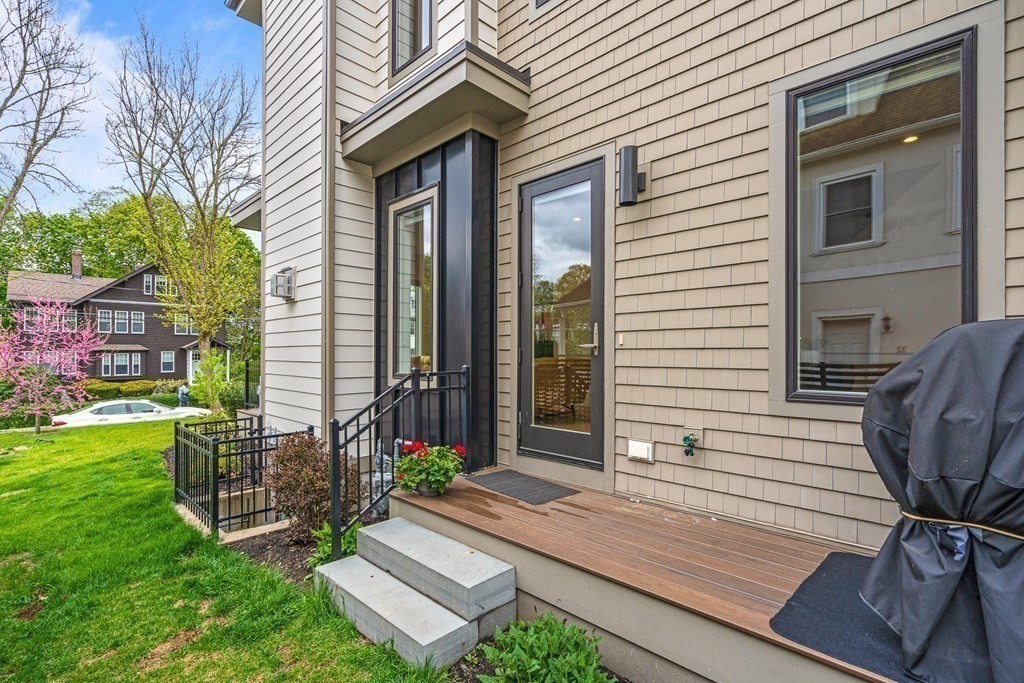 26 Salisbury Road, Unit 26 Newton, MA 02458 - Photo 25 of 27 a view of a house with backyard and a chair