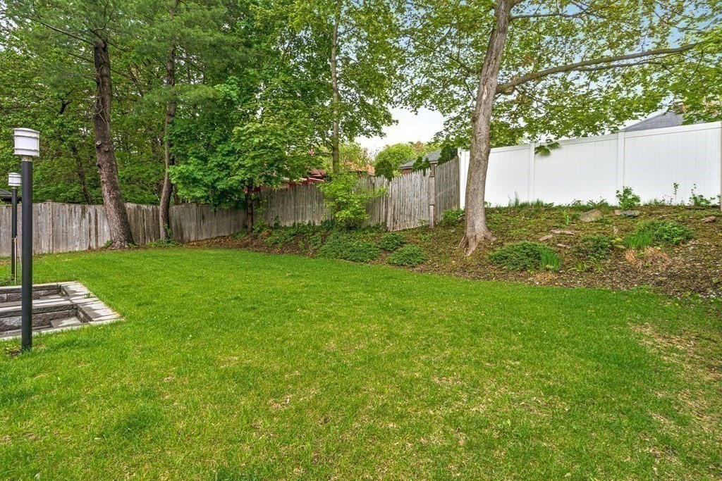 26 Salisbury Road, Unit 26 Newton, MA 02458 - Photo 26 of 27 a view of a backyard with large trees