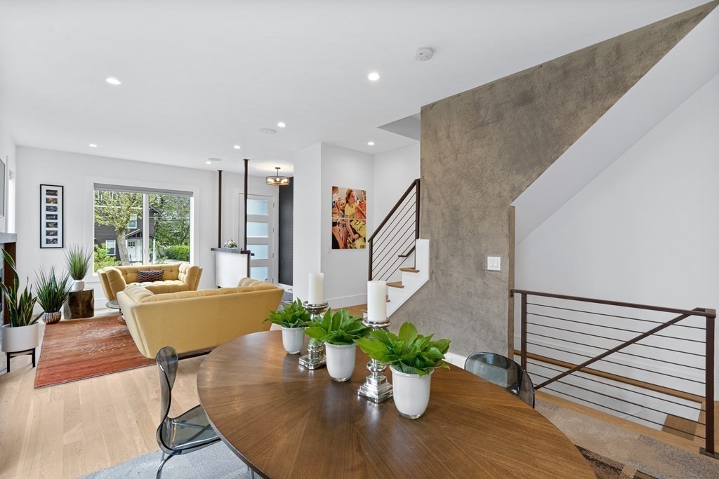 26 Salisbury Road, Unit 26 Newton, MA 02458 - Photo 5 of 27 a living room with furniture potted plant and a floor to ceiling window