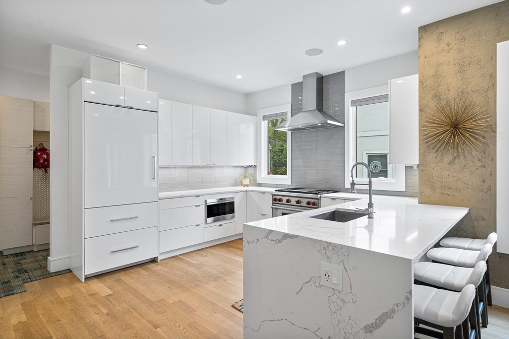 26 Salisbury Road, Unit 26 Newton, MA 02458 - Photo 7 of 27 a kitchen with a sink stove and white cabinets