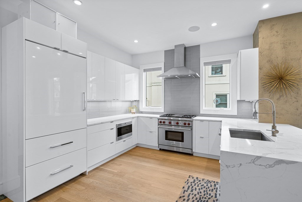 26 Salisbury Road, Unit 26 Newton, MA 02458 - Photo 8 of 27 a large kitchen with stainless steel appliances granite countertop a stove and a sink